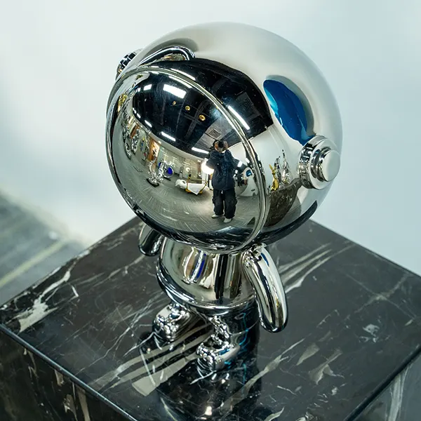Contemporary Steel Astronaut Sculpture – Reflective Chrome Art Piece