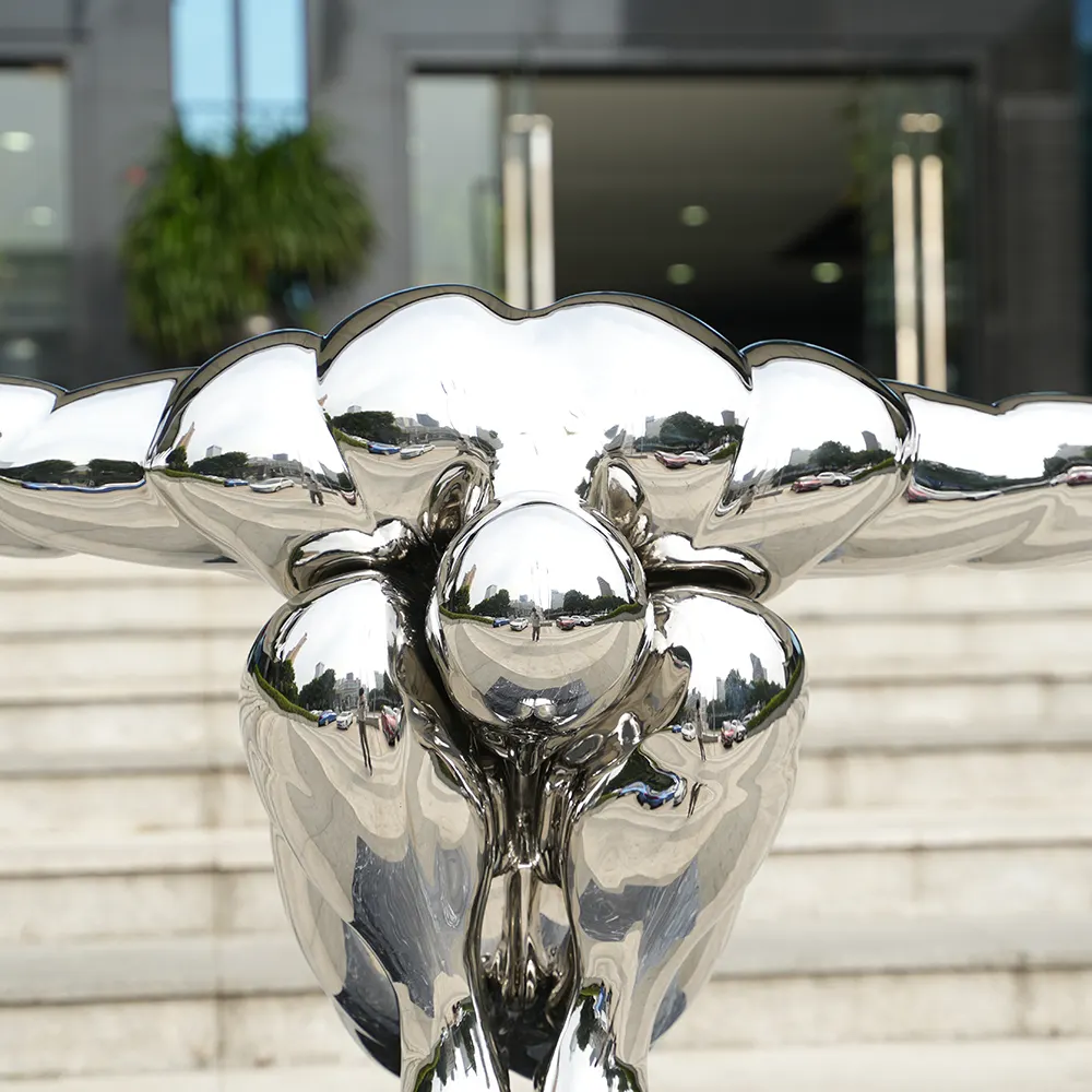 Steel Sculpture of Diving Human Figure – Modern Reflective Art Installation