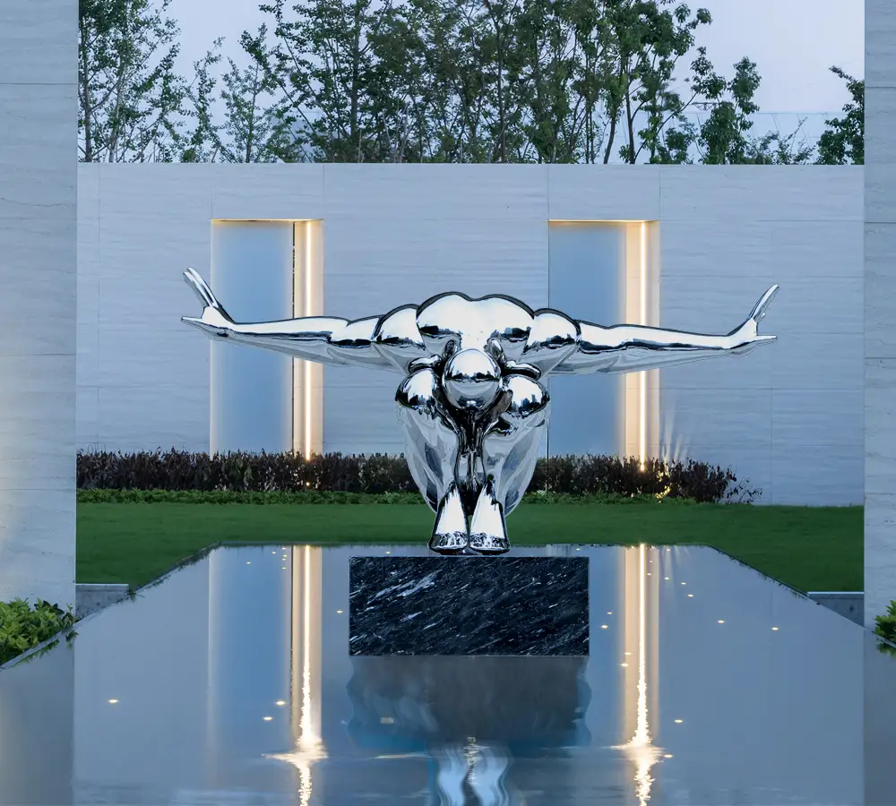 Steel Sculpture of Diving Human Figure – Modern Reflective Art Installation
