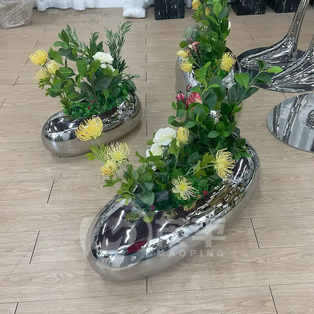 Stainless steel pebble shape shape flowerpot for garden decoration