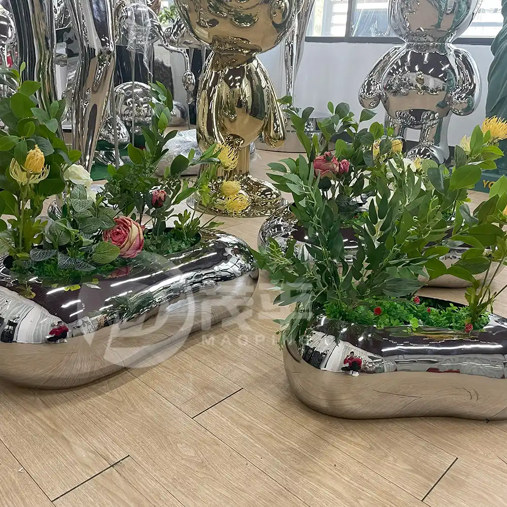 Stainless steel pebble shape shape flowerpot for garden decoration