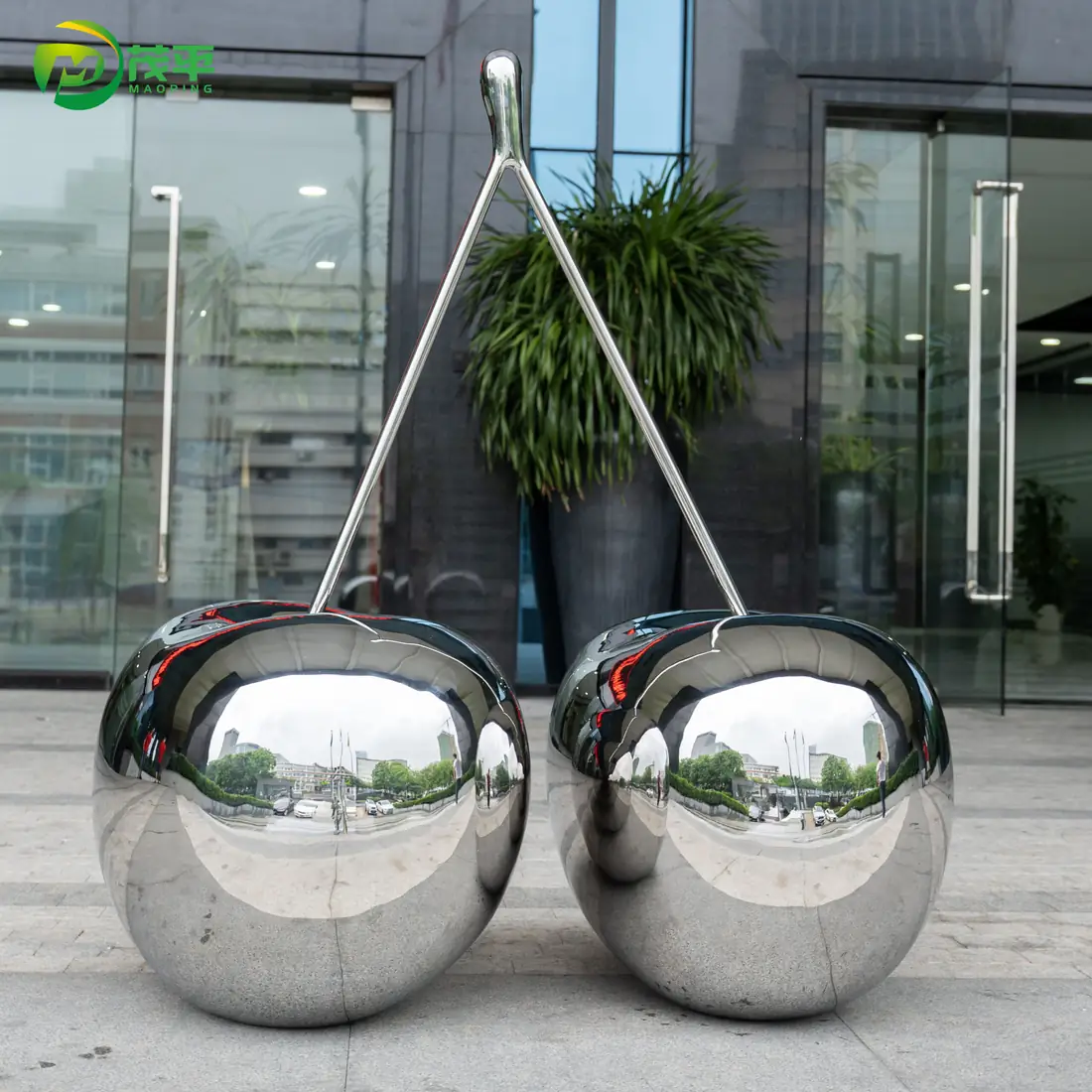 Polished cherry stainless steel sculpture