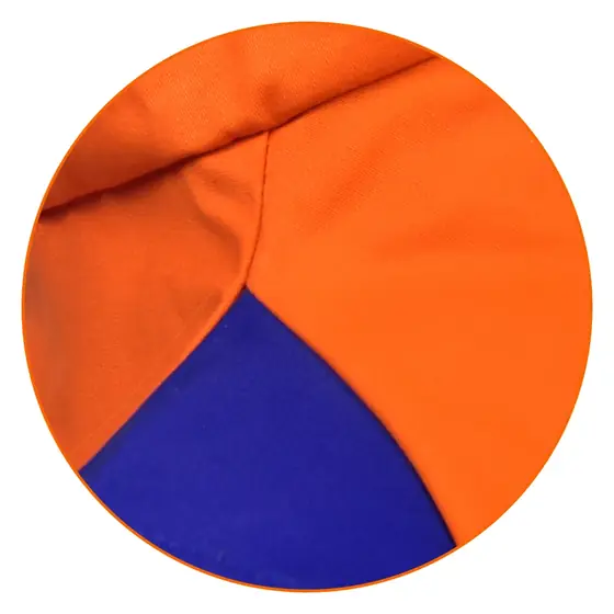 Orange FR welding hood worn under a helmet