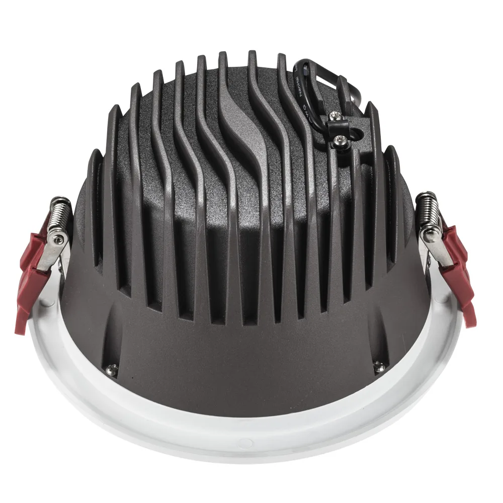 Group of five recessed downlights installed in a ceiling with flush fit and even spacing