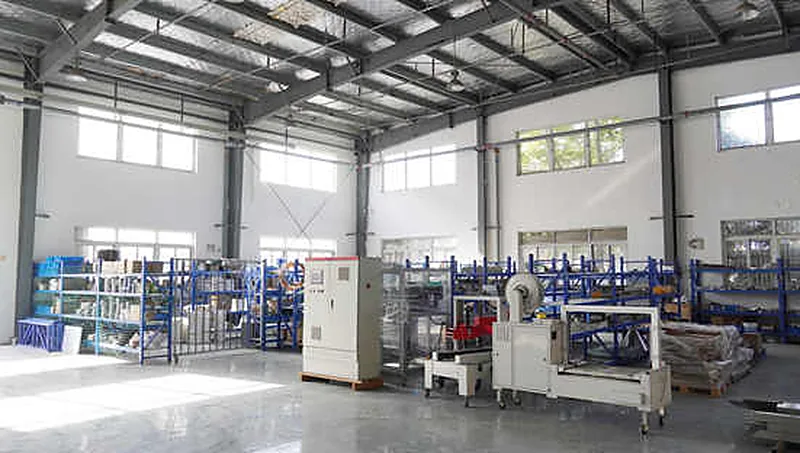Assembly bay. Frames, conveyors and weighing modules are built up and wired on the floor before the line is dry-run.