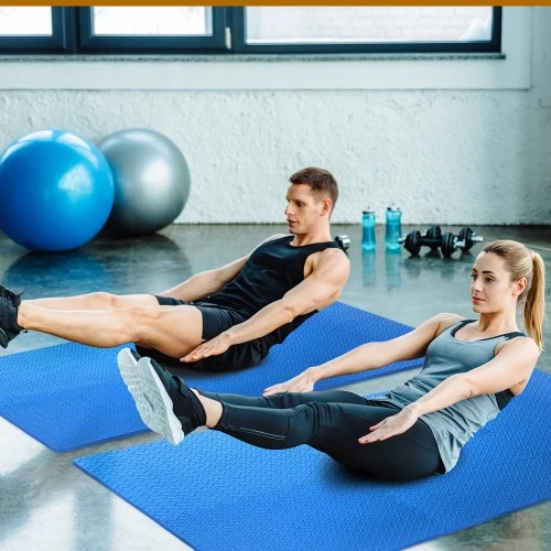Leaf-pattern EVA foam mats laid as gym flooring under fitness equipment