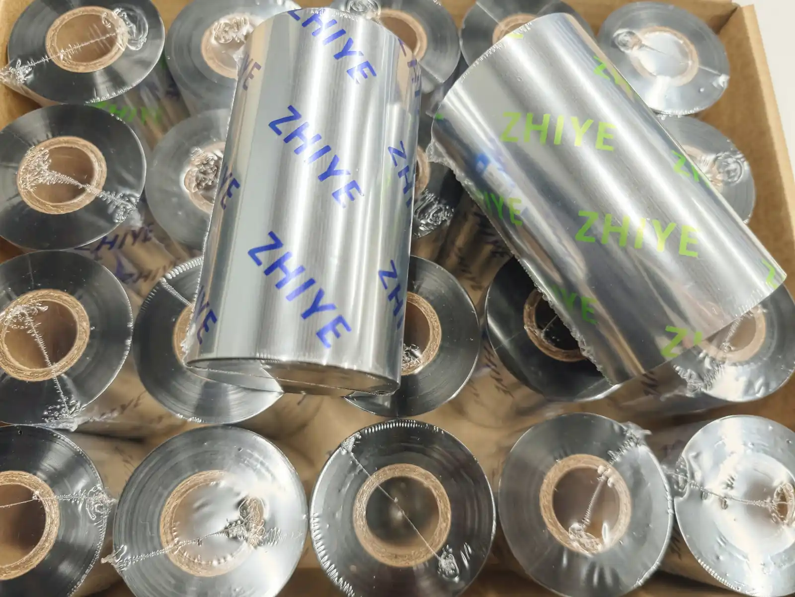 Thermal transfer ribbon rolls packed in a carton after slitting