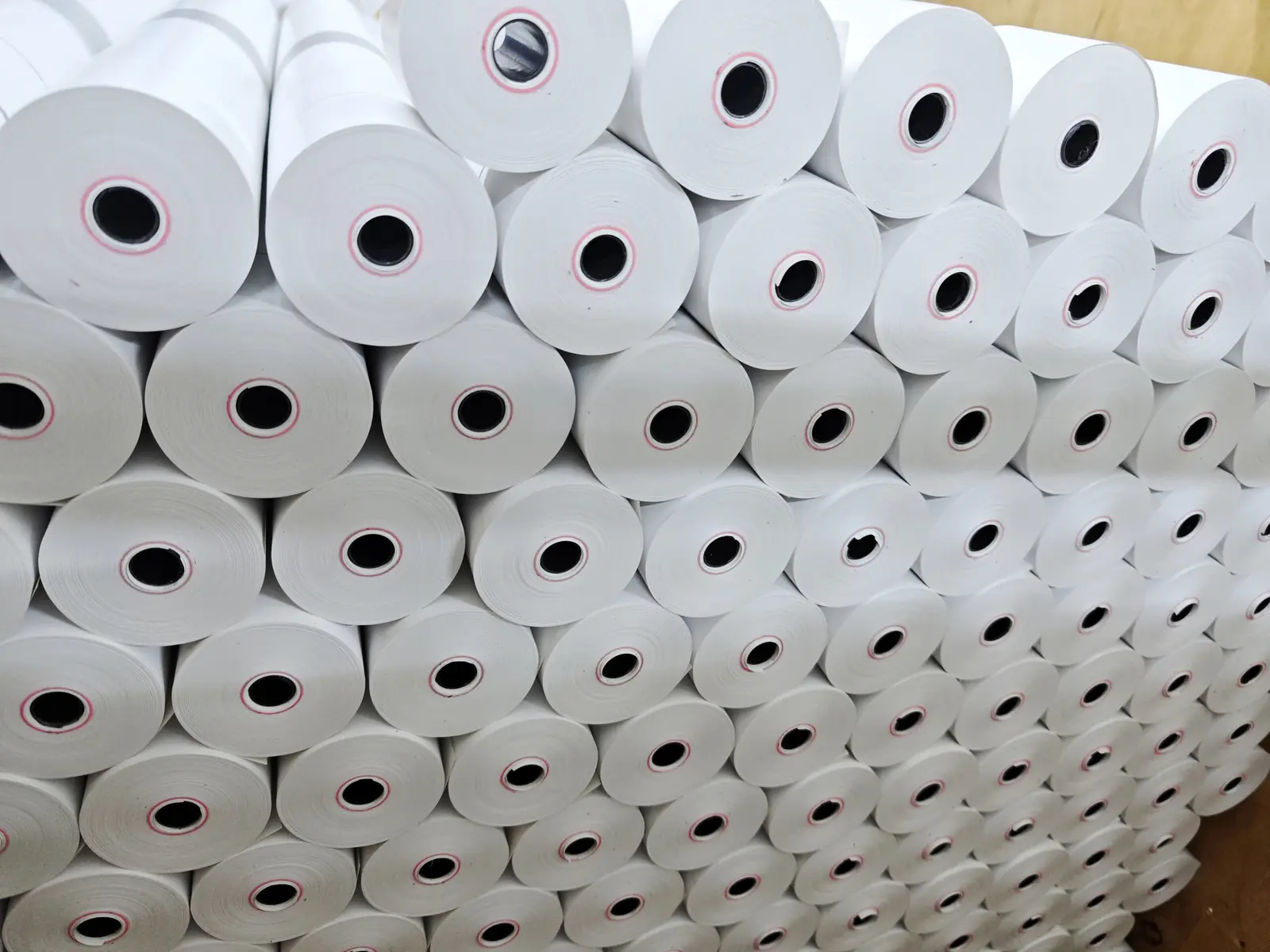 BPA free thermal paper till rolls stacked after slitting and packing