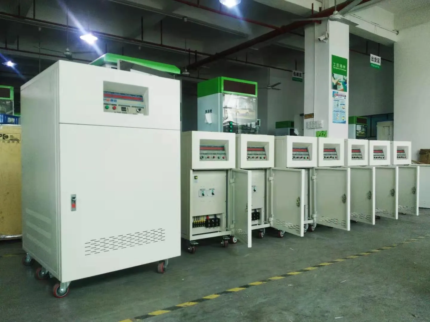 Completed AC power source cabinets staged in the Shenzhen assembly area before final test