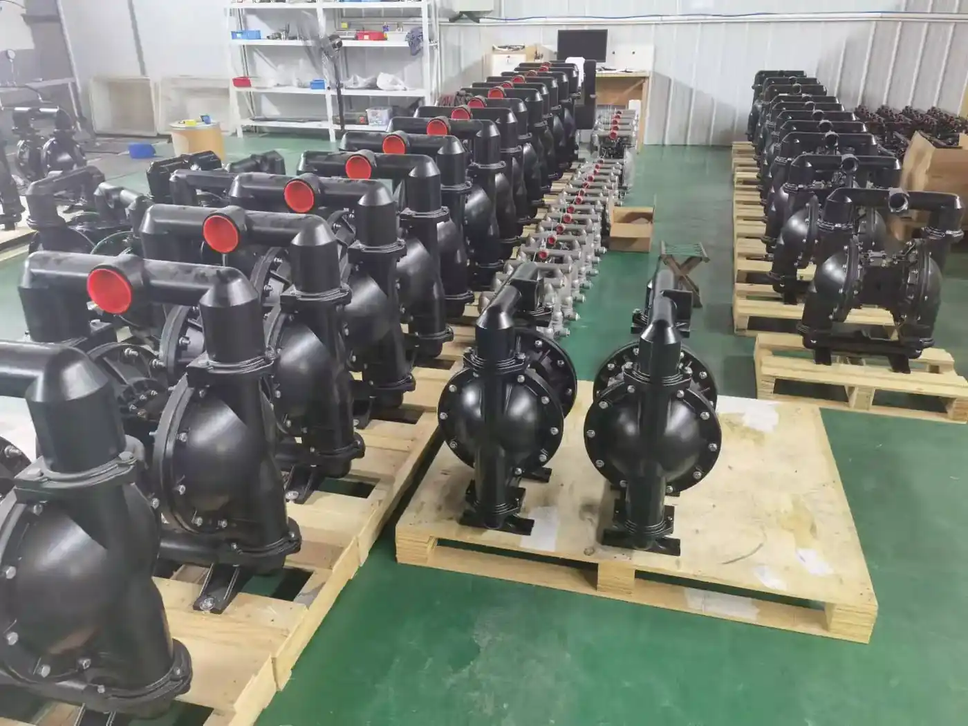 Assembled Nuodean AODD pumps lined up on pallets before packing