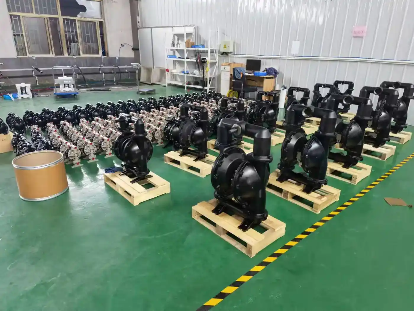 Rows of finished Nuodean diaphragm pumps on pallets in the factory
