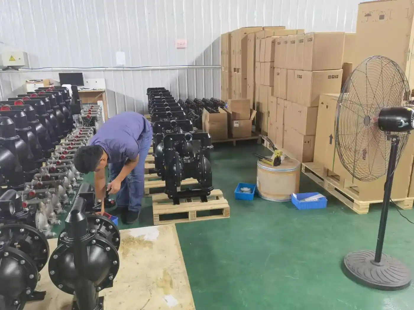 Nuodean technician assembling air operated diaphragm pumps on the production floor