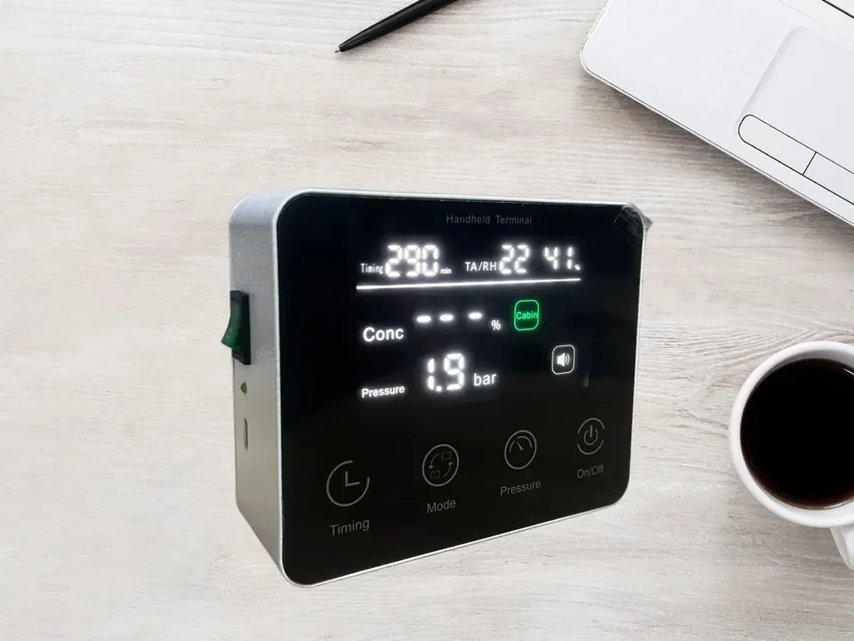 Handheld controller display showing oxygen concentration and pressure