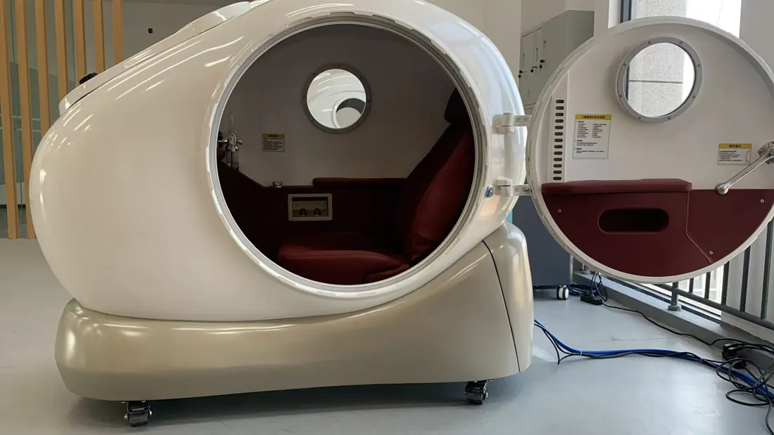 OHE20 hard-shell sitting chamber with the door open showing the seat