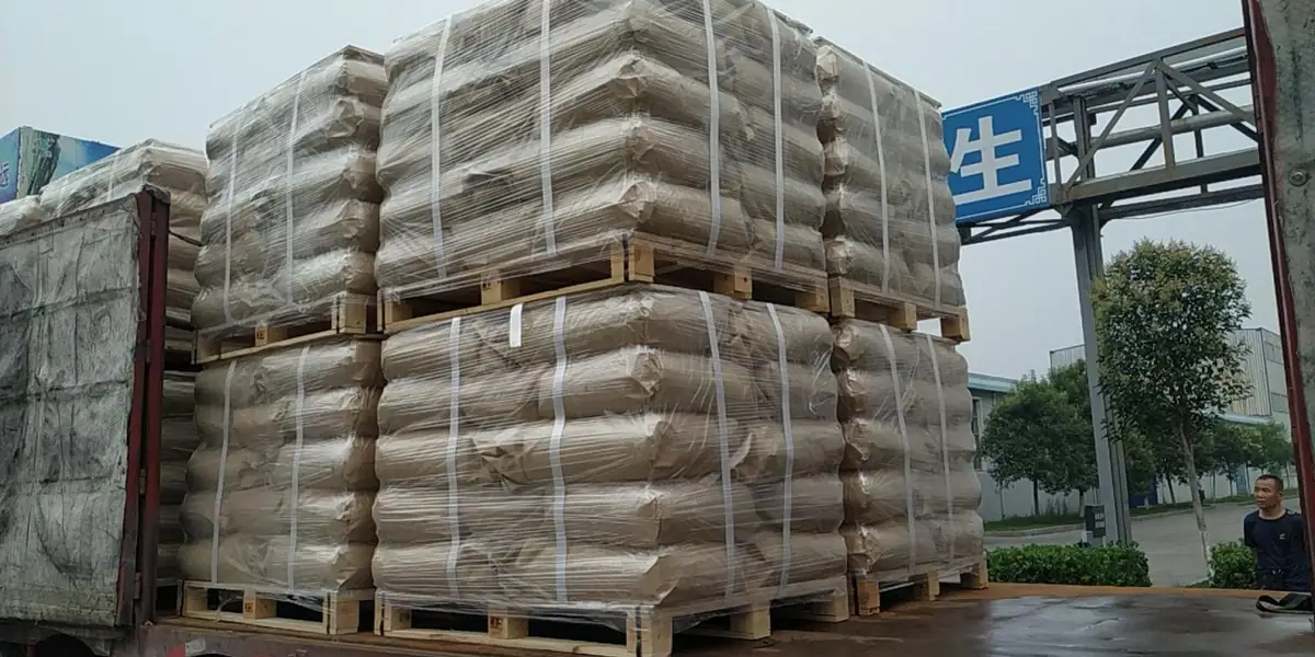 Palletised and shrink-wrapped optical brightener bags ready for export
