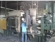 Surface treatment area — castings are processed here before final finishing.
