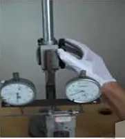 Dial gauge checking on a fixture — routine in-process dimensional control.