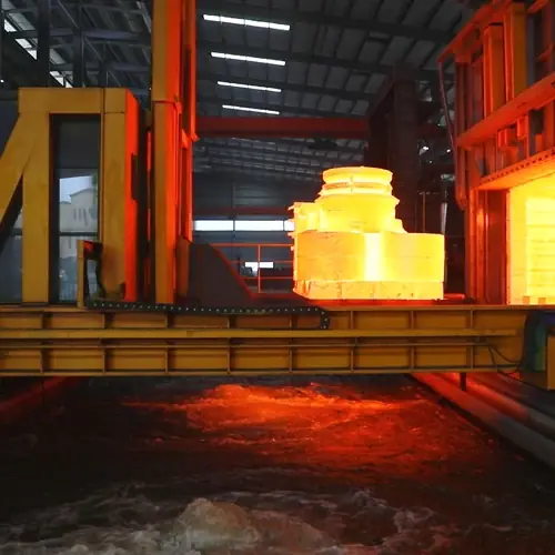Castings glowing at temperature on the heat treatment trolley