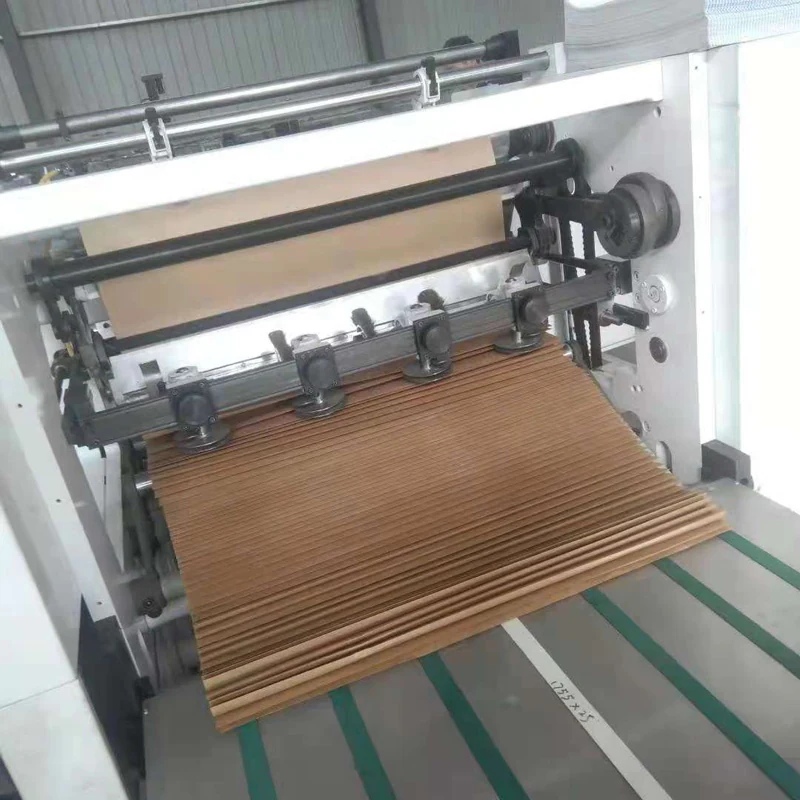 Kraft paper being perforated and folded into a fanfold stack