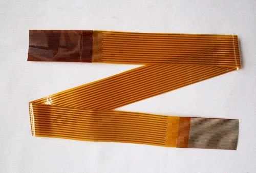Single layer flex ribbon cable with parallel conductors folded into a Z and stiffened at both ends