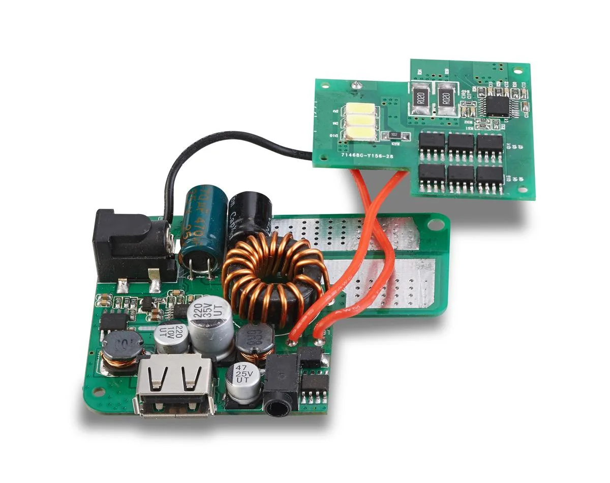 Assembled DC-DC converter PCBA with a toroidal inductor and USB output wired to an LED driver board