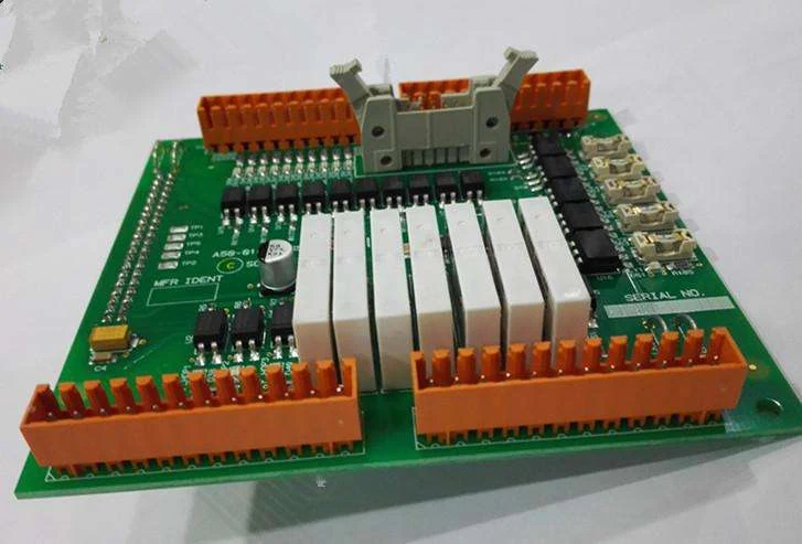 Assembled industrial IO PCBA with a relay bank and two rows of pluggable screw terminal blocks