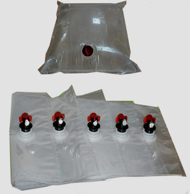 Transparent plastic bag-in-box liners with red and black dispensing taps on white background
