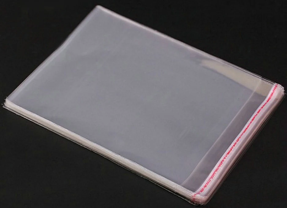 Stack of clear self-seal plastic bags on black background