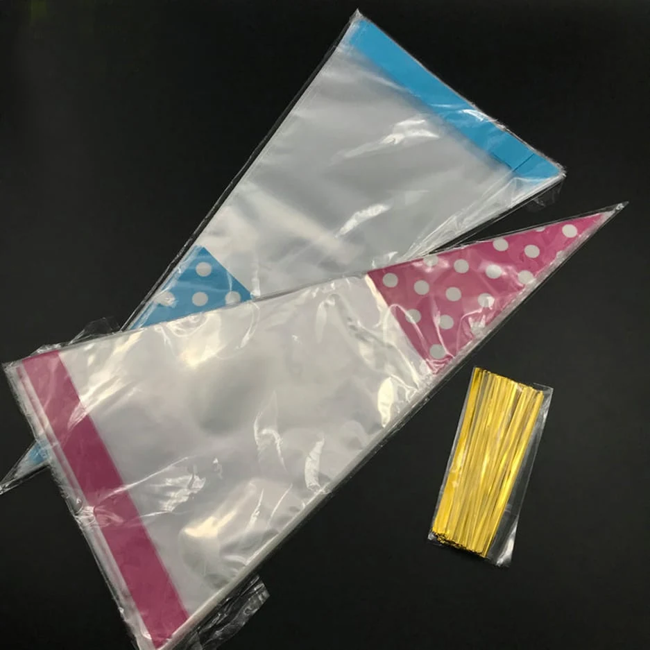 Two clear cone-shaped plastic bags with polka dots and gold twist ties on black background