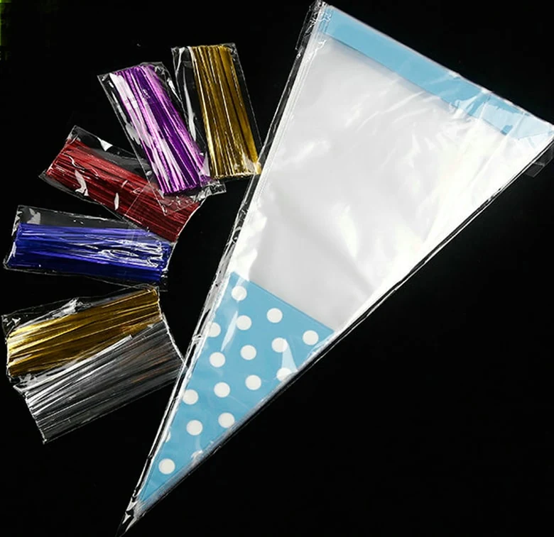 Clear cone cellophane bag with blue polka dots and colorful twist ties on black background