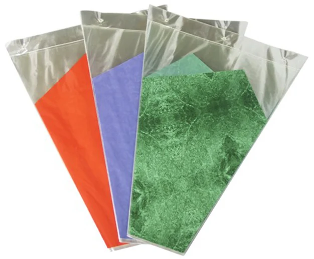 Three clear plastic sleeves with orange, purple and green inserts fanned on white