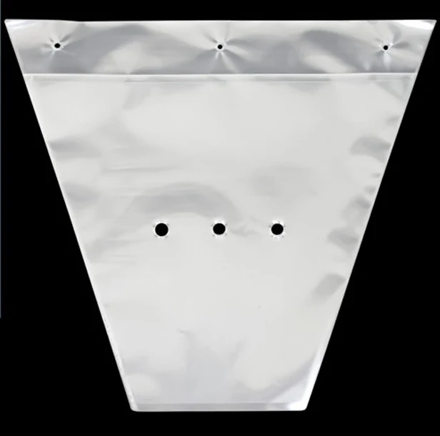Transparent tapered plastic bag with small holes displayed on black background