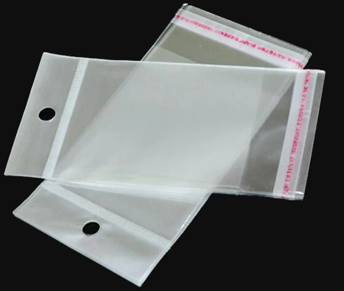 Two clear plastic self-seal bags with hang holes on black background