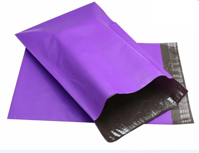 Two purple plastic mailing bags with one open on white background