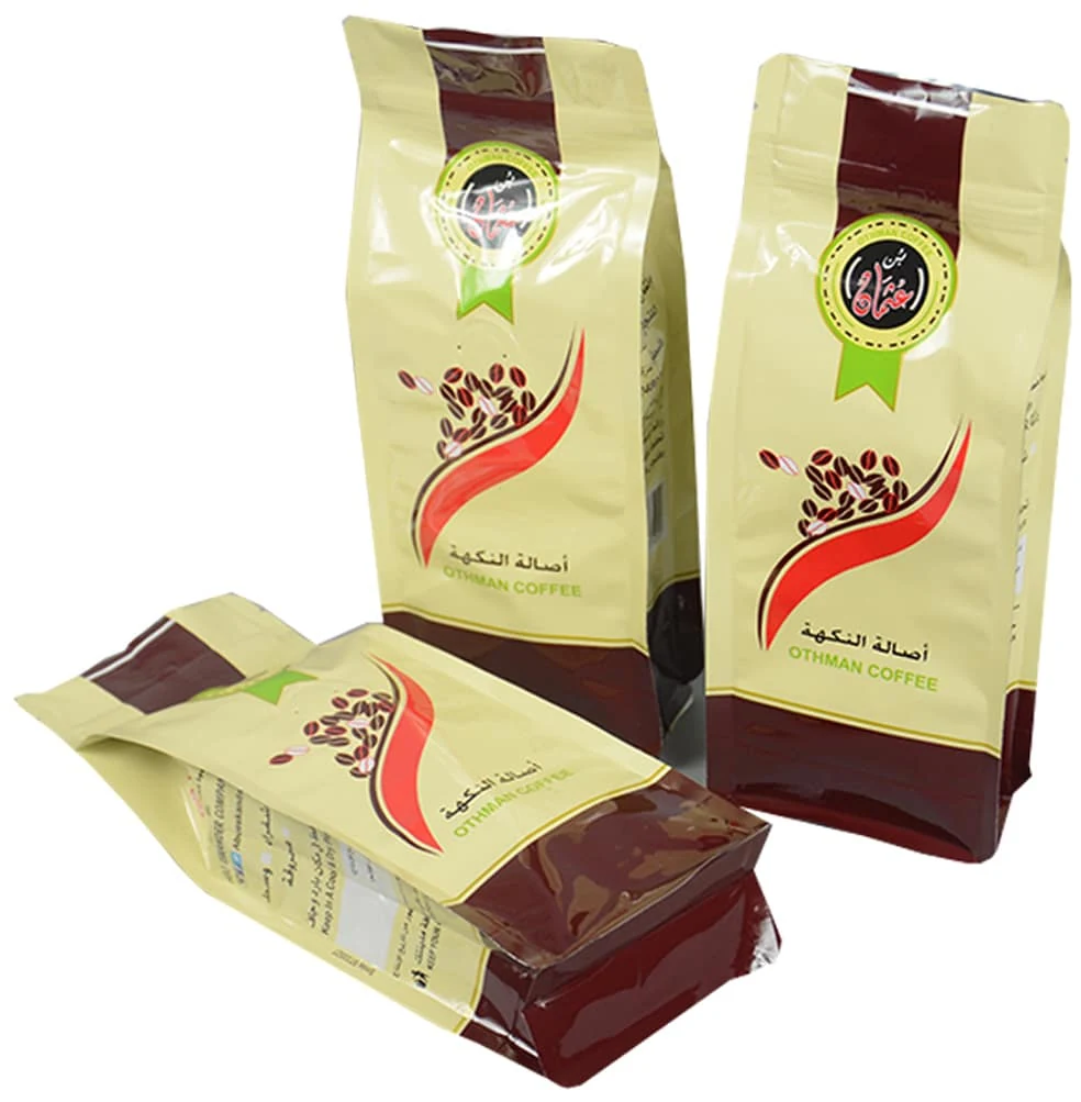 Three beige and brown coffee pouches with bean graphics on white background