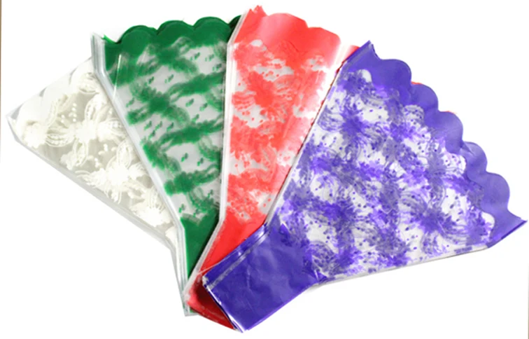 Four colorful printed plastic flower bouquet sleeves fanned out on white background