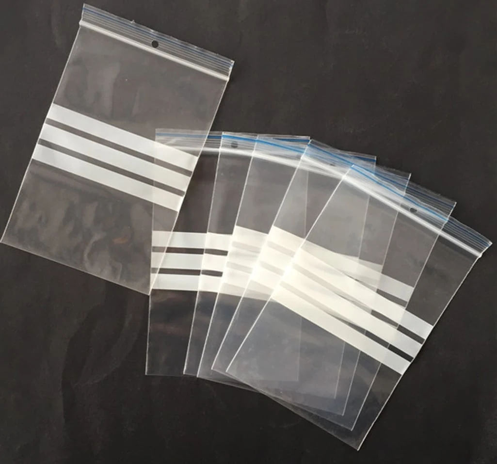 Clear resealable plastic zip bags with white stripes on black background