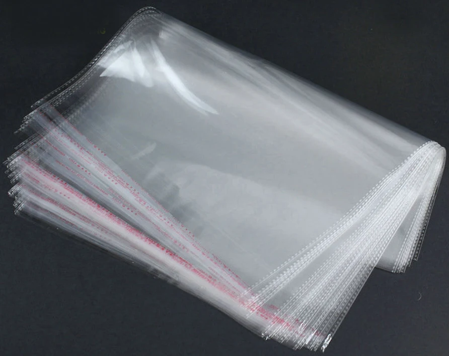Stack of clear transparent plastic bags on dark background