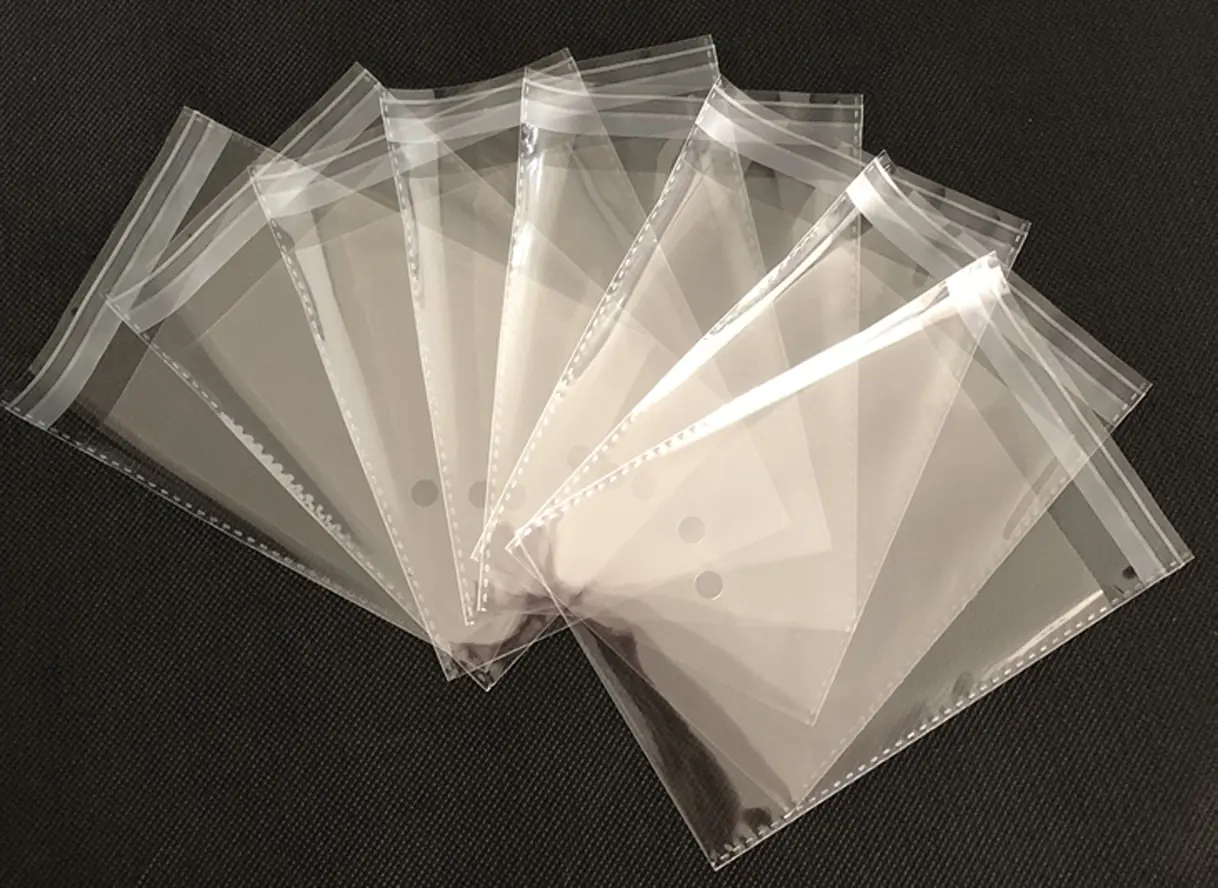 Clear plastic resealable bags fanned out on dark surface