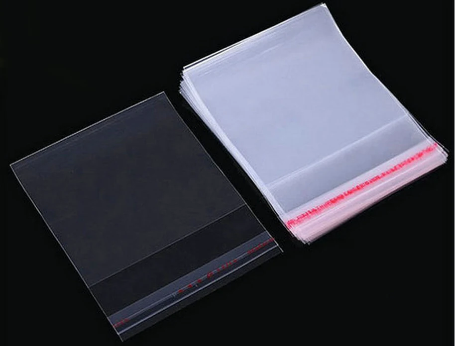 Two stacks of clear resealable plastic bags on black background