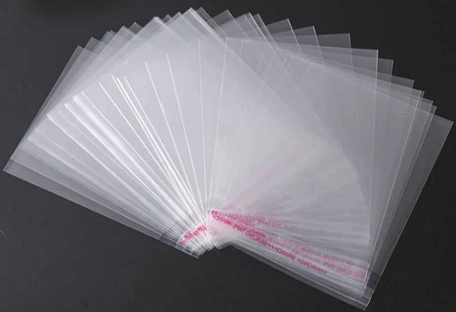 Clear plastic bags fanned out on black background