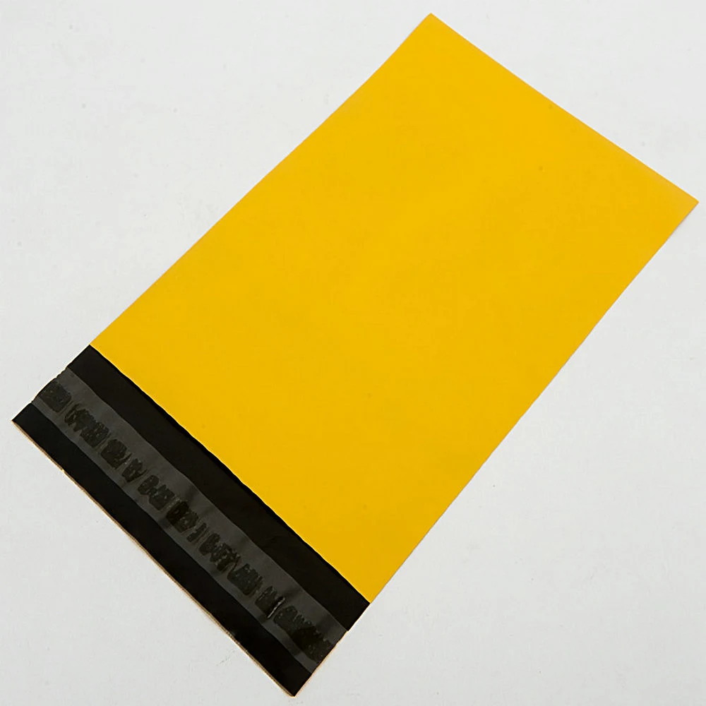Yellow poly mailer shipping bag with black adhesive strip on white background