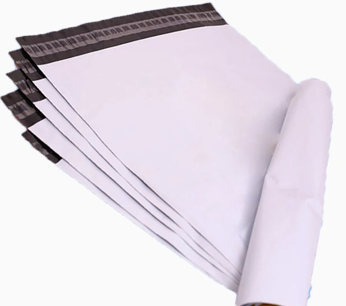 Stack of white poly mailer shipping bags with black adhesive strips
