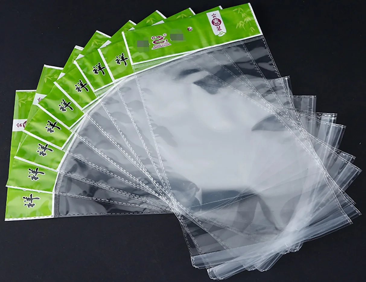 Fanned clear plastic bags with green printed headers on black background