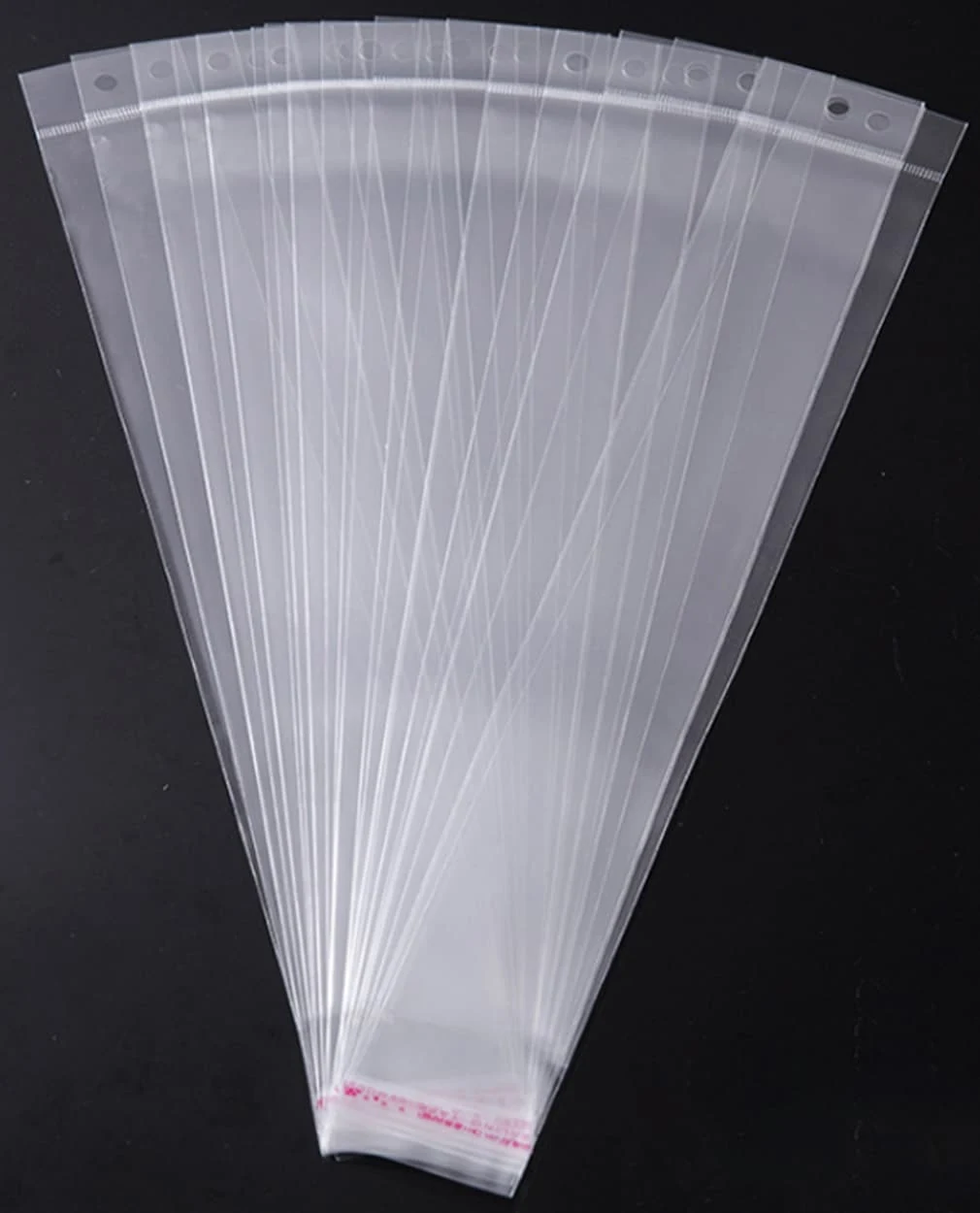 Clear plastic resealable bags fanned out on black background