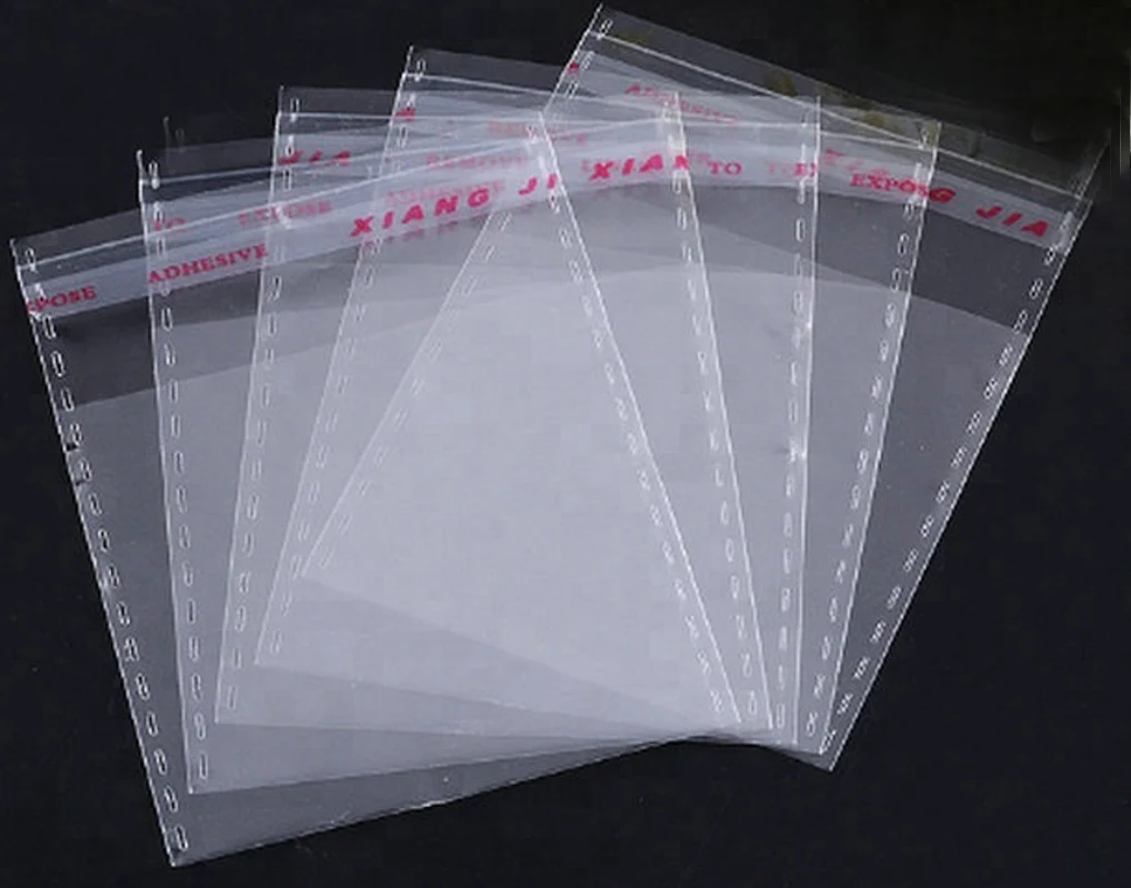 Five transparent self-adhesive plastic bags fanned out on black background