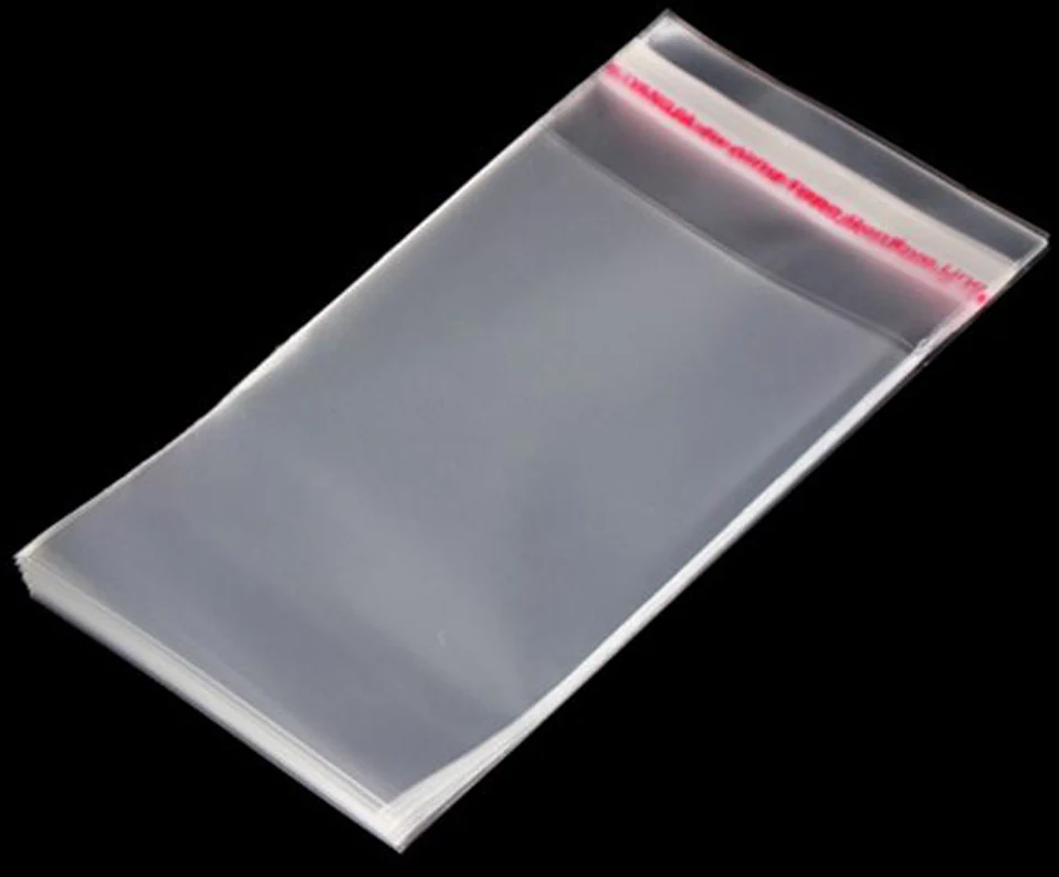 Stack of transparent resealable plastic bags on black background