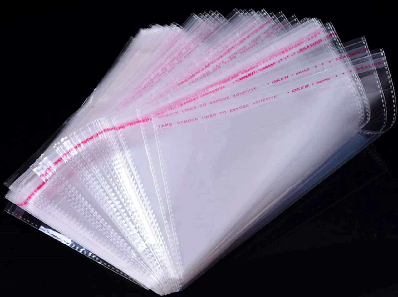 Fanned clear self-seal plastic bags with pink strips on black background