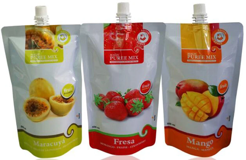 Three stand-up spout pouches of fruit puree mix in passion fruit, strawberry and mango flavors