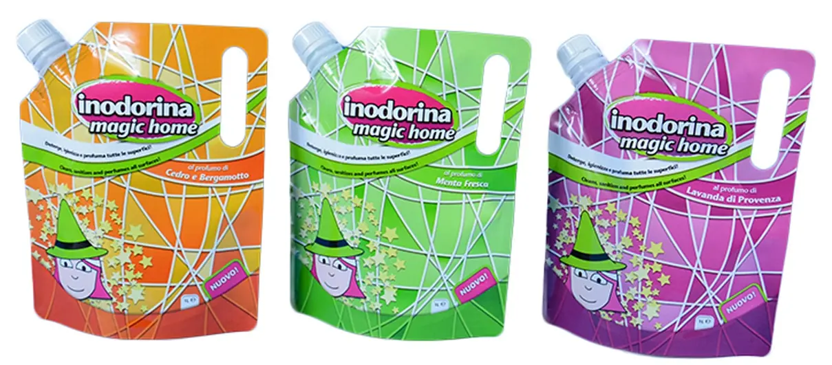 Three colorful spouted pouches with witch cartoon on white background